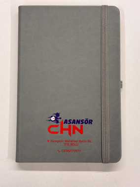 13 x 21 cm Termo PU Sert Kapaklı Tarihsiz EKONOMİK Defter, 160 Sayfa, 60 gr Holmen Krem Çizgili İç Kağıt, Esnek Kapak Lastikli, Kalem Tutuculu